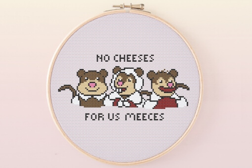 A design of three mice from Muppets Christmas Carol, above and below is the phrase 'No cheeses for us meeces'.